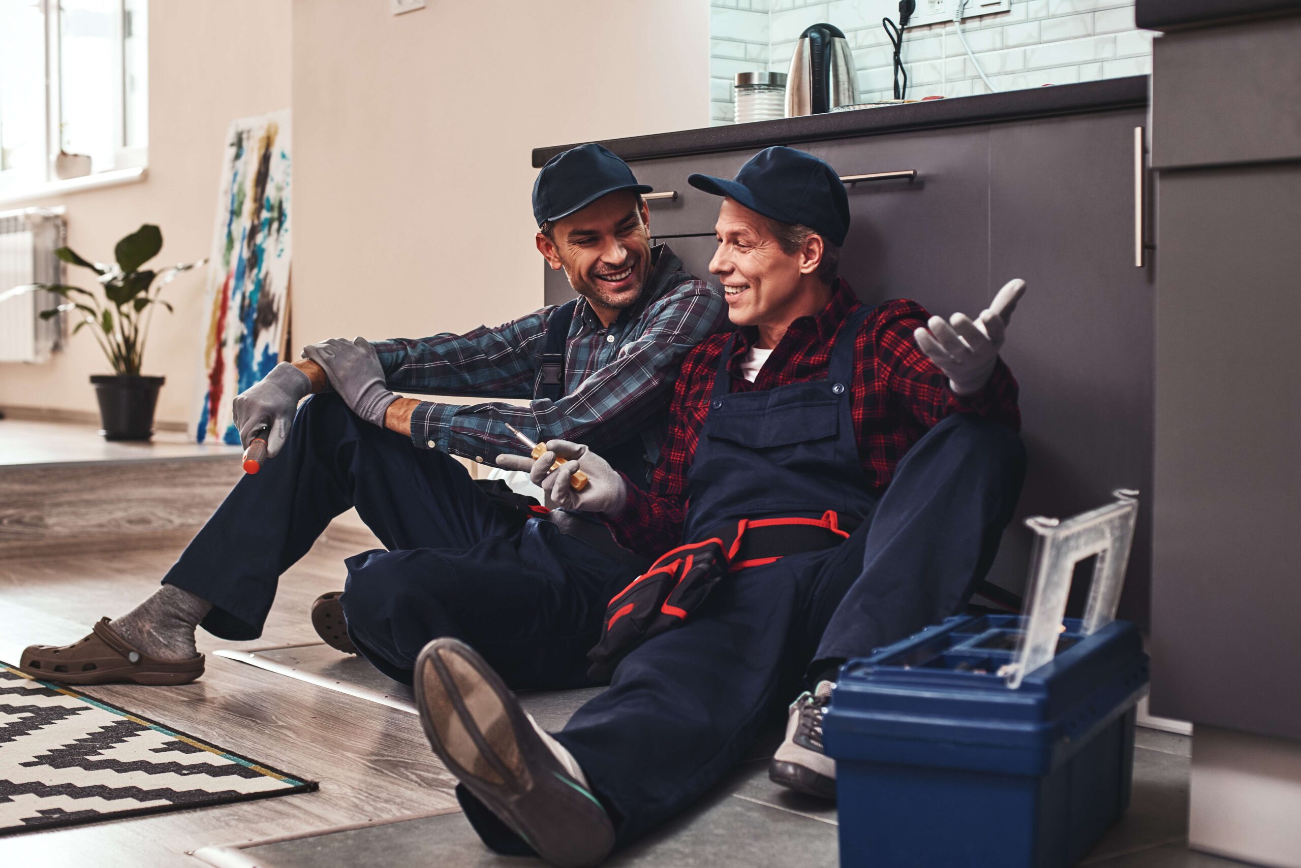 little-rest-after-hard-work-two-handymen-sitting-scaled
