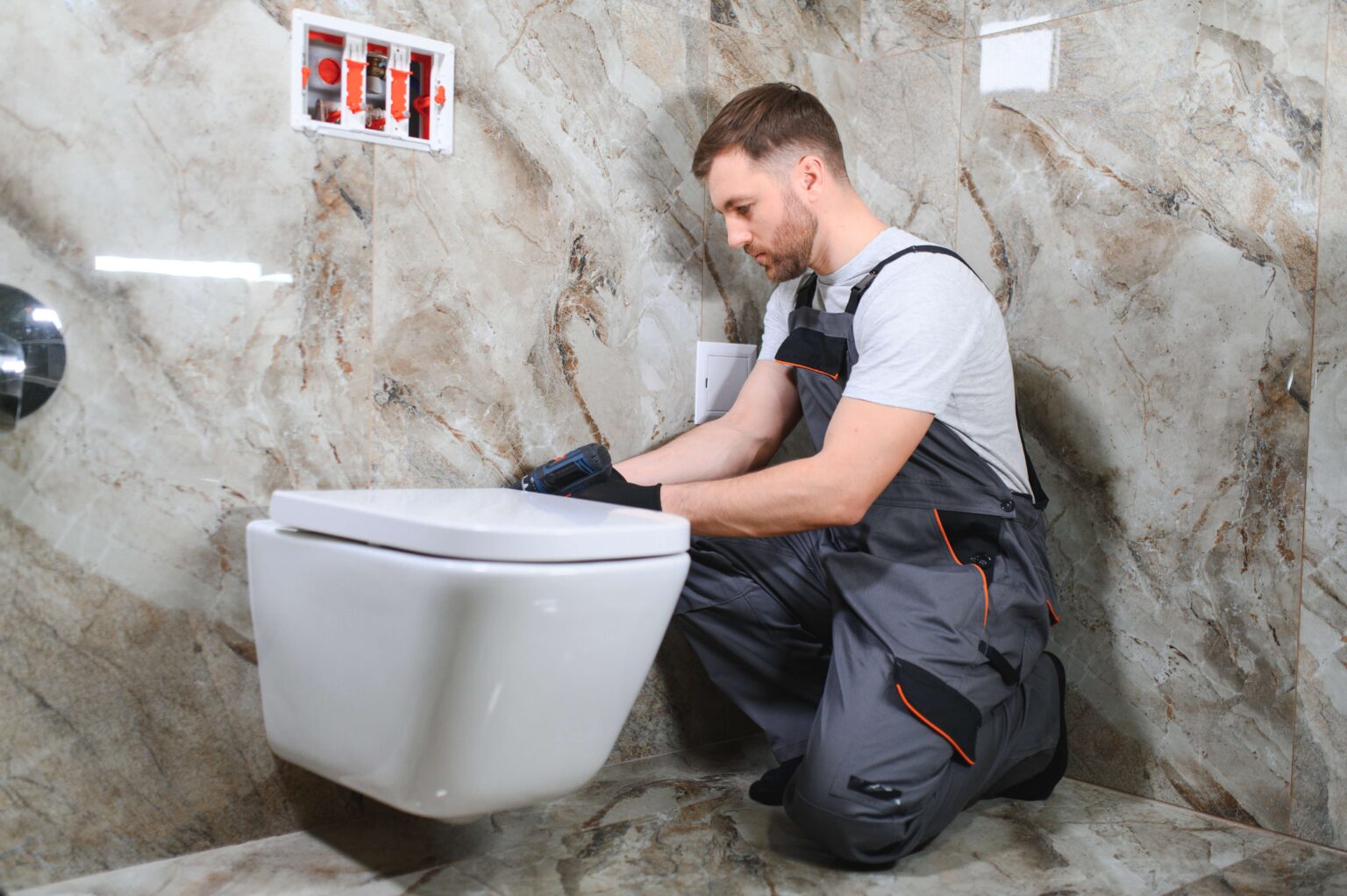 http://professional-plumber-working-with-toilet-bowl