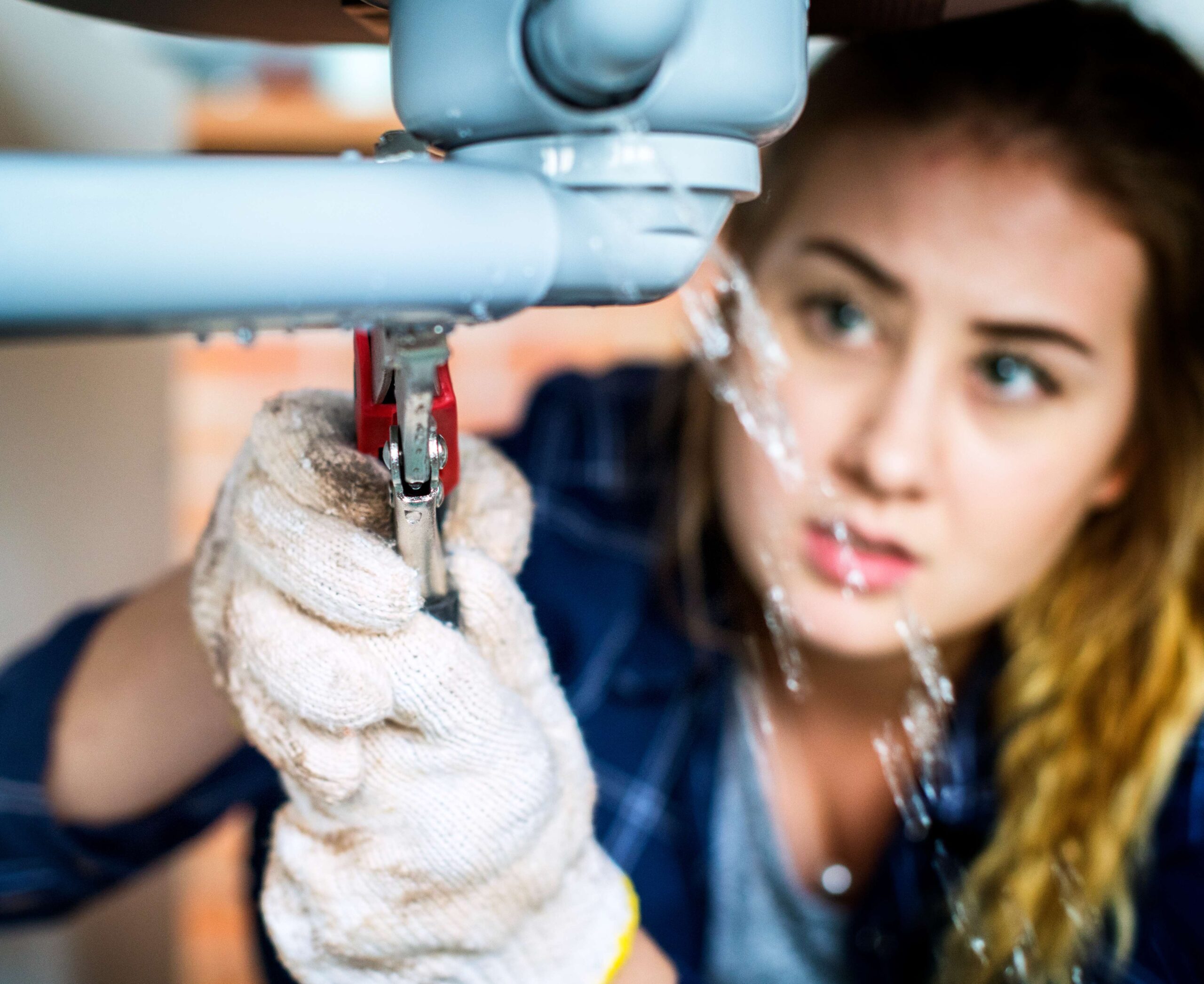 woman-fixing-her-own-toilet-sink